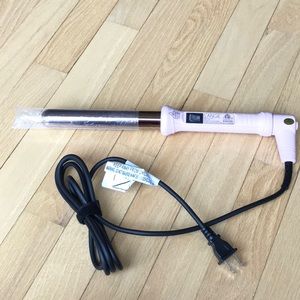 L’ange curling wand never used , still has plastic wrap on the barrel